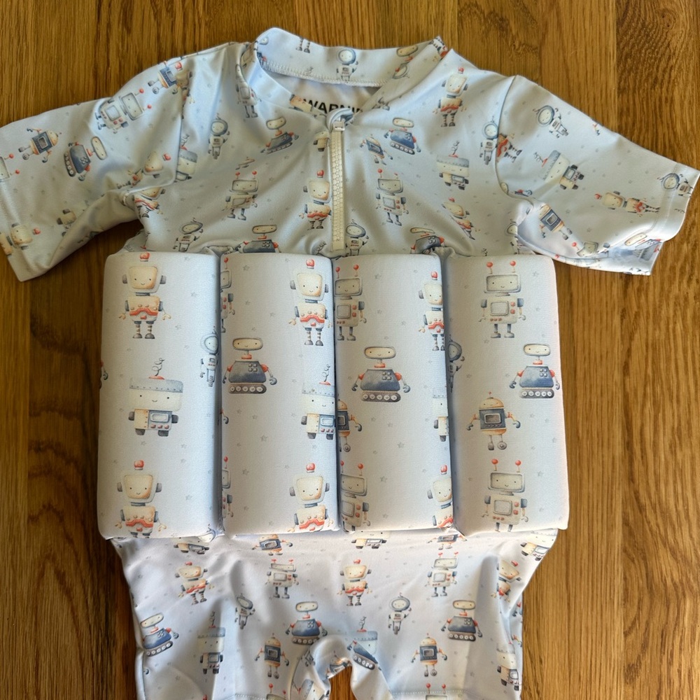 Lil Soleil boy swimsuit. Size large. Adorable tractor print